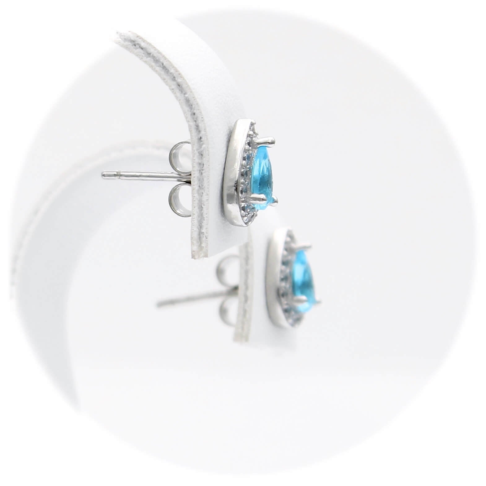 Ασημένια σκουλαρίκια ροζέτες σε σχήμα δάκρυ με γαλάζιες πέτρες