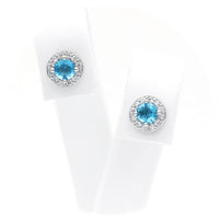 Ασημένια σκουλαρίκια ροζέτες σε στρογγυλό σχήμα με γαλάζιες πέτρες ζιργκόν