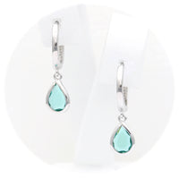 Ασημένια κρεμαστά σκουλαρίκια με γαλαζοπράσινες πέτρες ζιργκόν