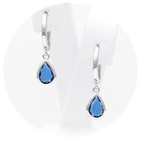 Ασημένια κρεμαστά σκουλαρίκια με μπλε πέτρες ζιργκόν