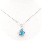 Ασημένιο κολιέ μοτίφ ροζέτα μπλε πέτρα