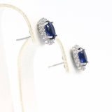 Σκουλαρίκια ροζέτες με σκούρες μπλε πέτρες ζιργκόν