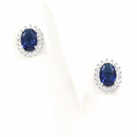 Σκουλαρίκια ροζέτες με σκούρες μπλε πέτρες ζιργκόν