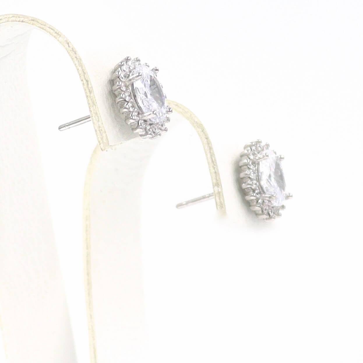 Σκουλαρίκια ροζέτες με λευκές πέτρες ζιργκόν