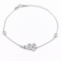 Ασημένιο βραχιόλι σε σχέδιο φίδι με πράσινα μάτια